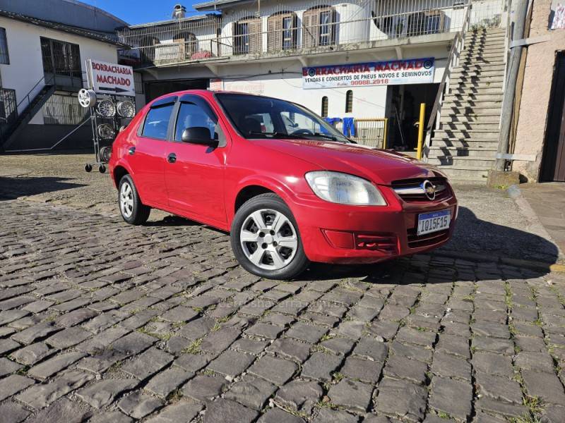 CHEVROLET - PRISMA - 2010/2010 - Vermelha - R$ 23.900,00